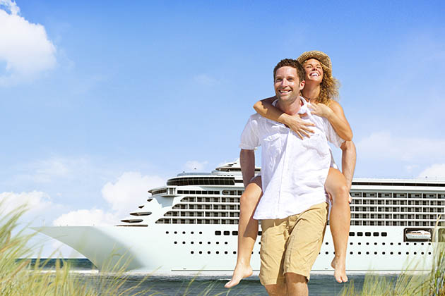 Couple flirting on a cruise ship deck at sunset with ocean views in the background